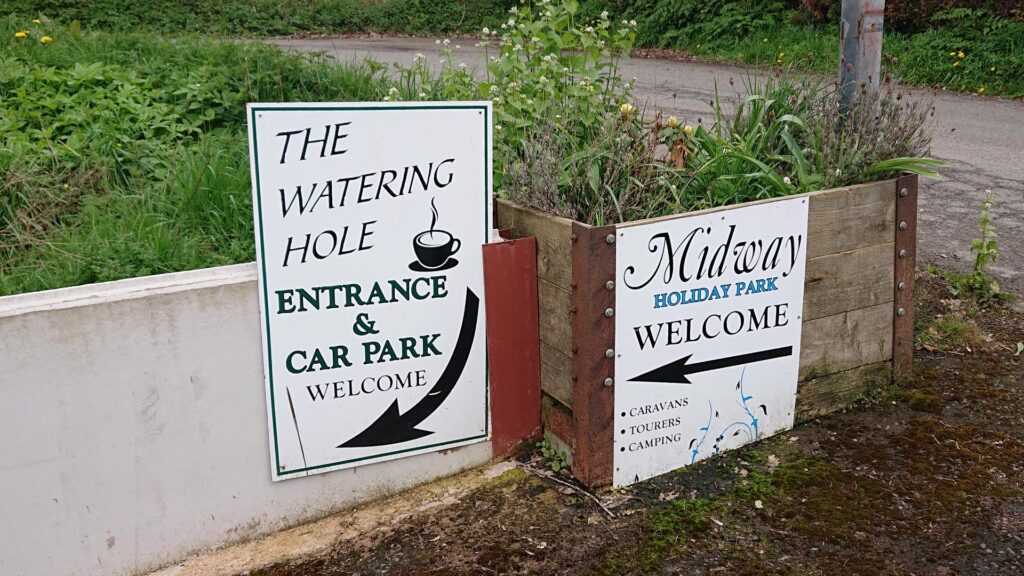 Signs for the Watering Hole Cafe