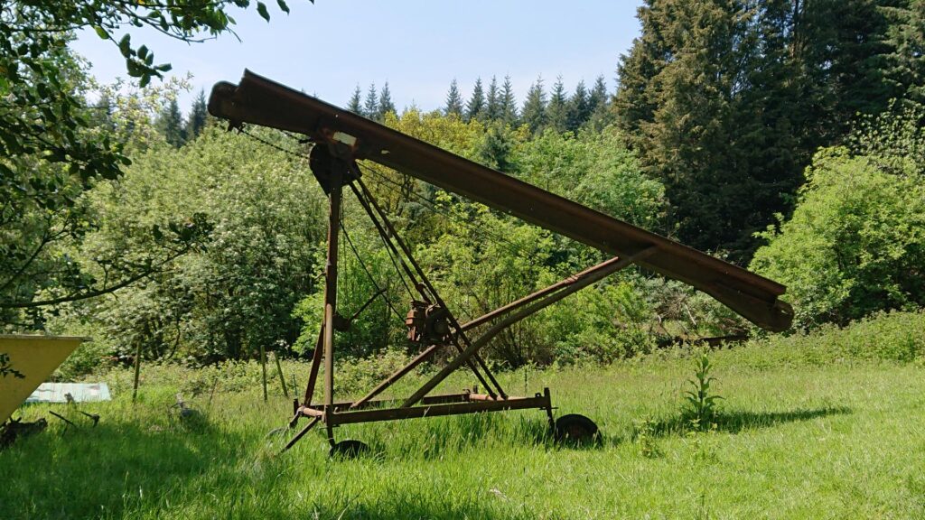 Old rusty farm machinery on the way to the Dionscourt Hill Trig Point